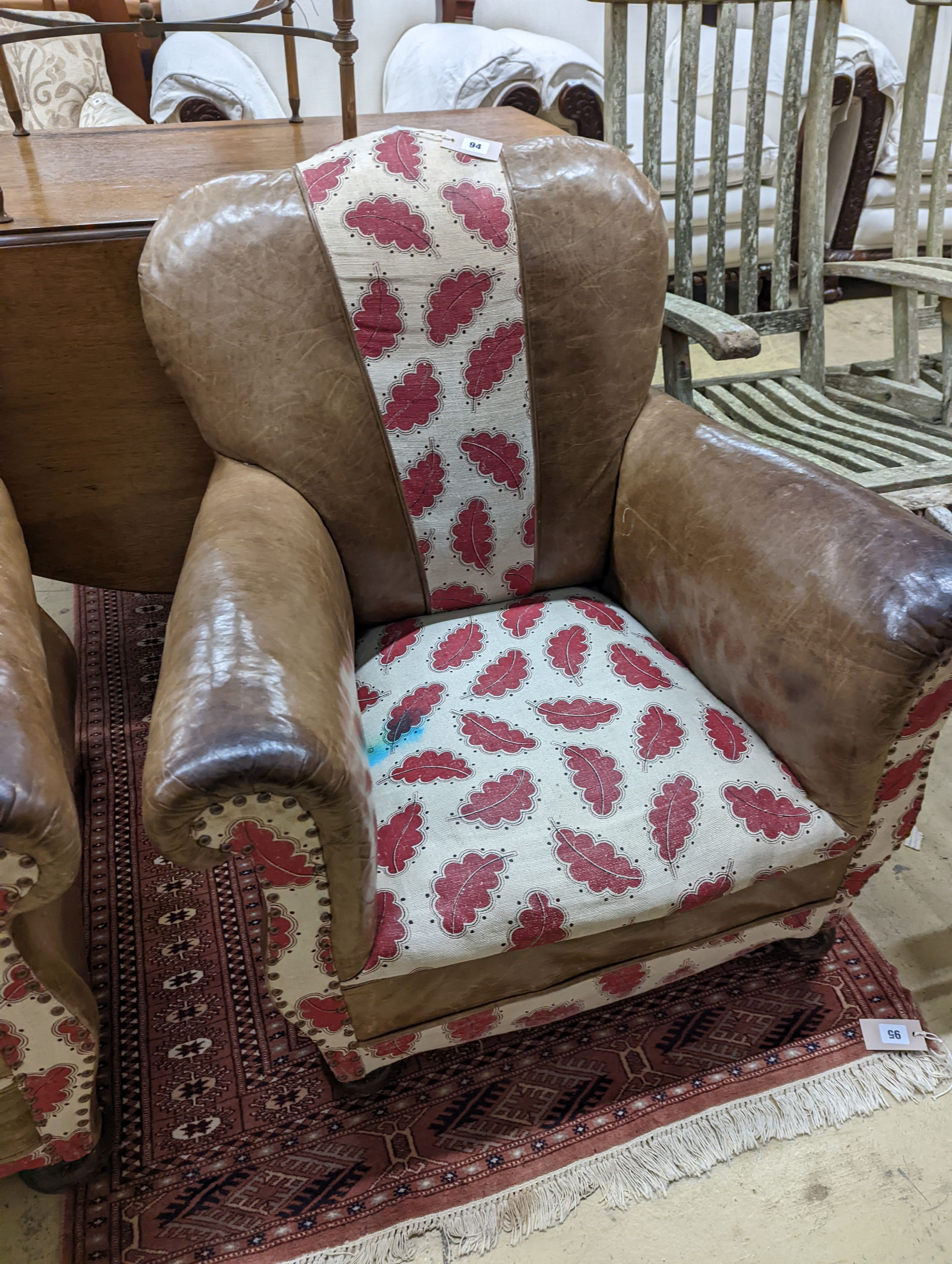 A pair of leather and fabric club armchairs. H-80cm.